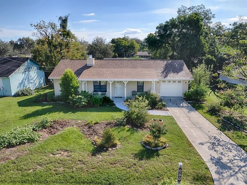 Driveway offers good parking, and established flower beds are waiting for you!