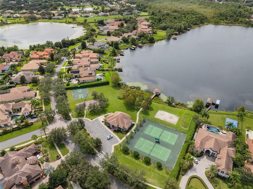 COMMUNITY CLUBHOUSE, WITH BASKETBALL COURT, TENNIS COURTS, SAND VOLLEYBALL PLAYGROUND AND PIER.