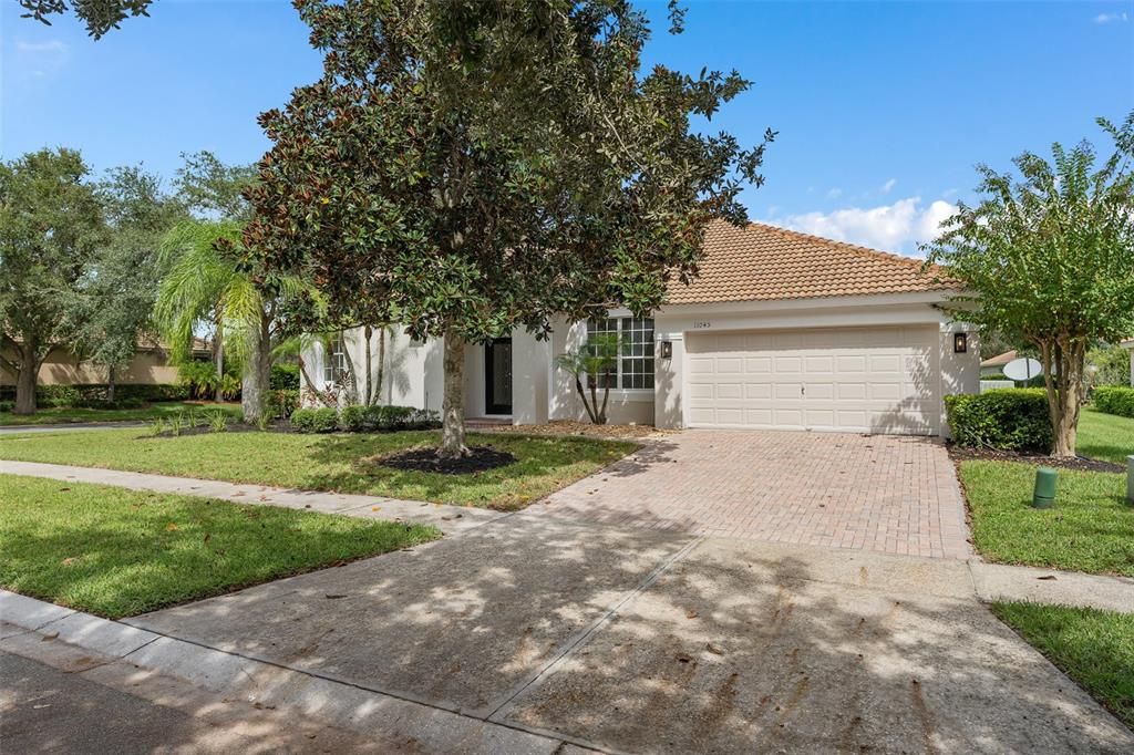 CORNER LOT SINGLE STORY TILE ROOF HOME WITH PAVER DRIVEWAY. HOME HAS BEEN COMPLETELY REPAINTED.