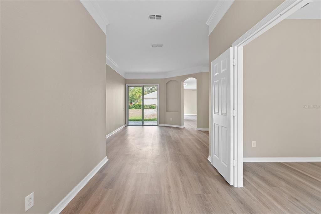 VIEW INTO THE HOUSE FROM THE FRONT DOUBLE DOORS. TO THE RIGHT IS THE DOUBLE DOOR OFFICE AND STRAIGHT AHEAD IS THE FORMAL LIVING ROOM. THIS HOUSE 4 SLIDING DOORS FOR TONS OF LIGHT!