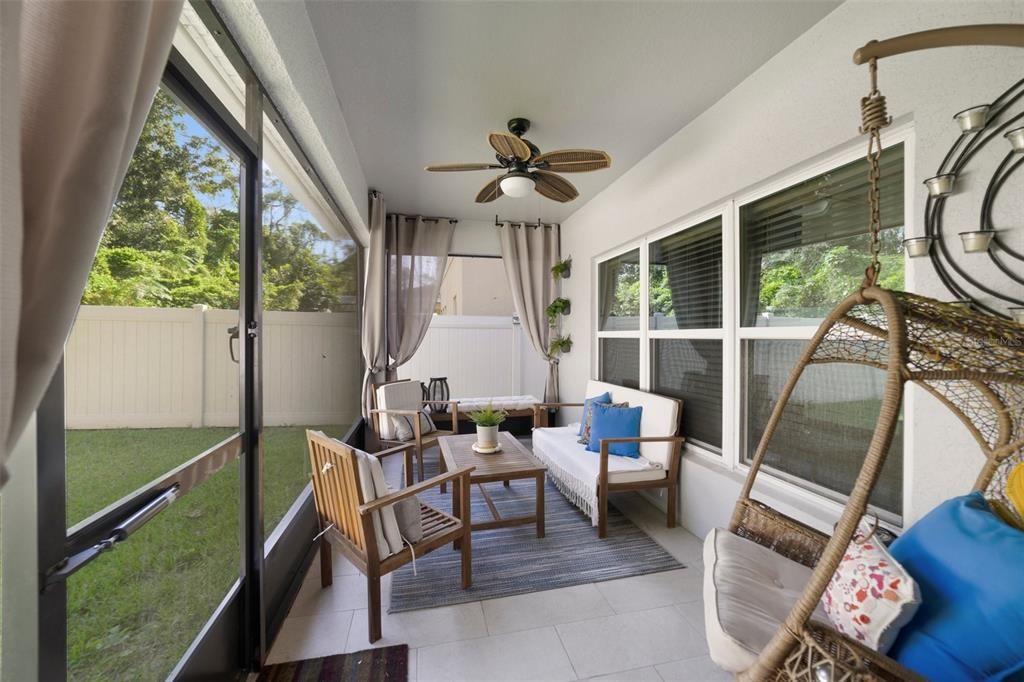 The SCREENED LANAI and private backyard with serene wooded views are perfect to relax and unwind at the end of a long day or host a weekend cookout - the choice is yours!