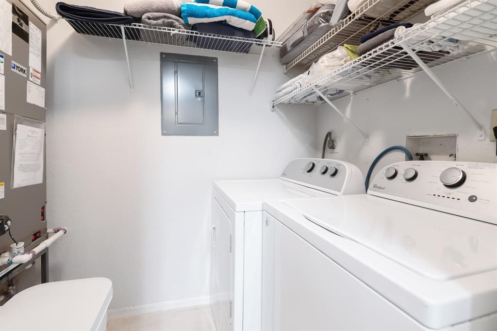 Laundry closet.  Washer and dryer convey