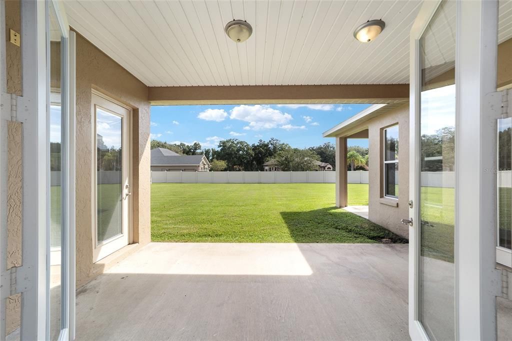 Backyard view on back covered patio from living room