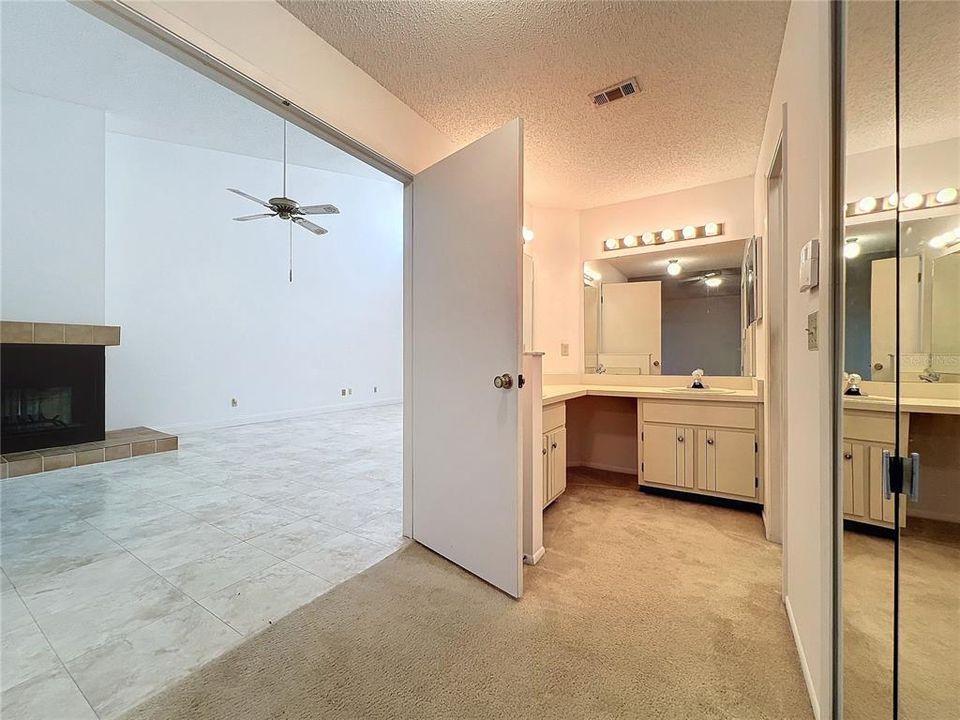 Double door entry leading from the family room to the Primary bedroom