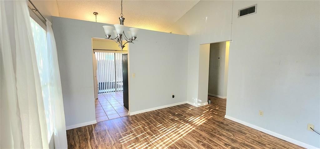 Dining area/Entry way to kitchen. Hallway to the right