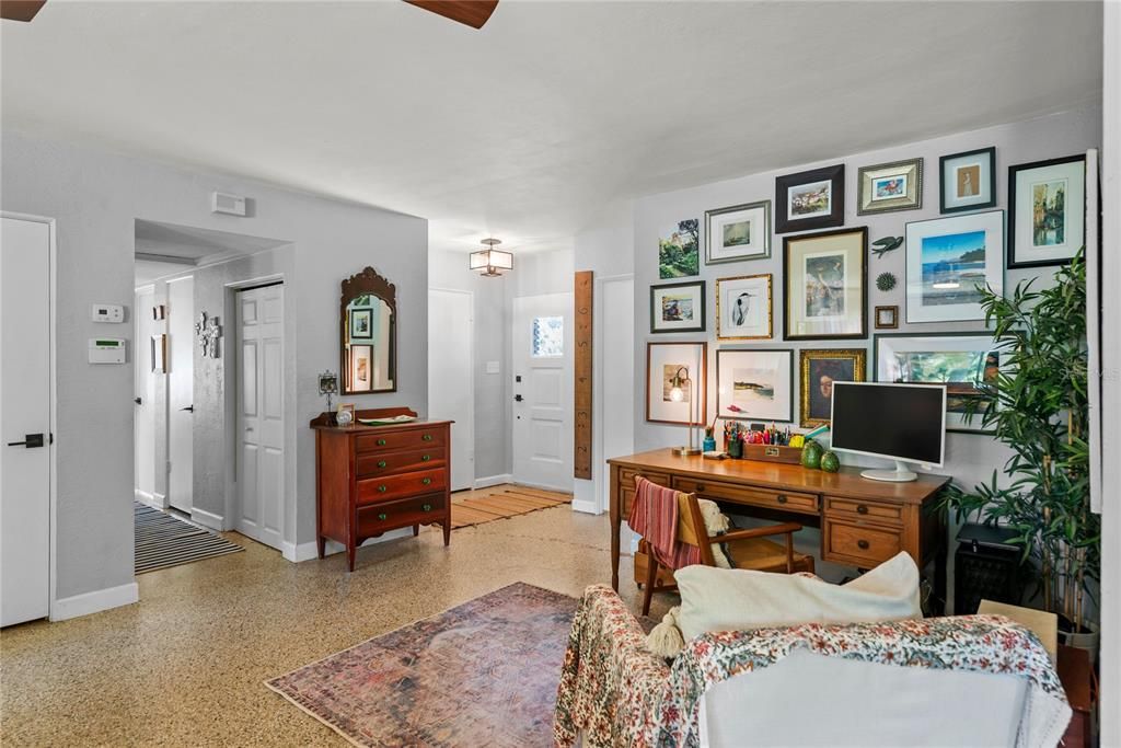 Open floor plan with lots of natural light and beautiful terrazzo floors