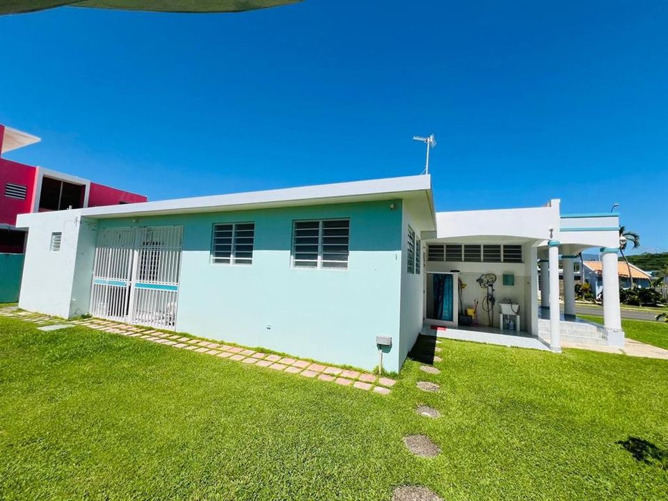 back yard and storage cage with balcony to the right side