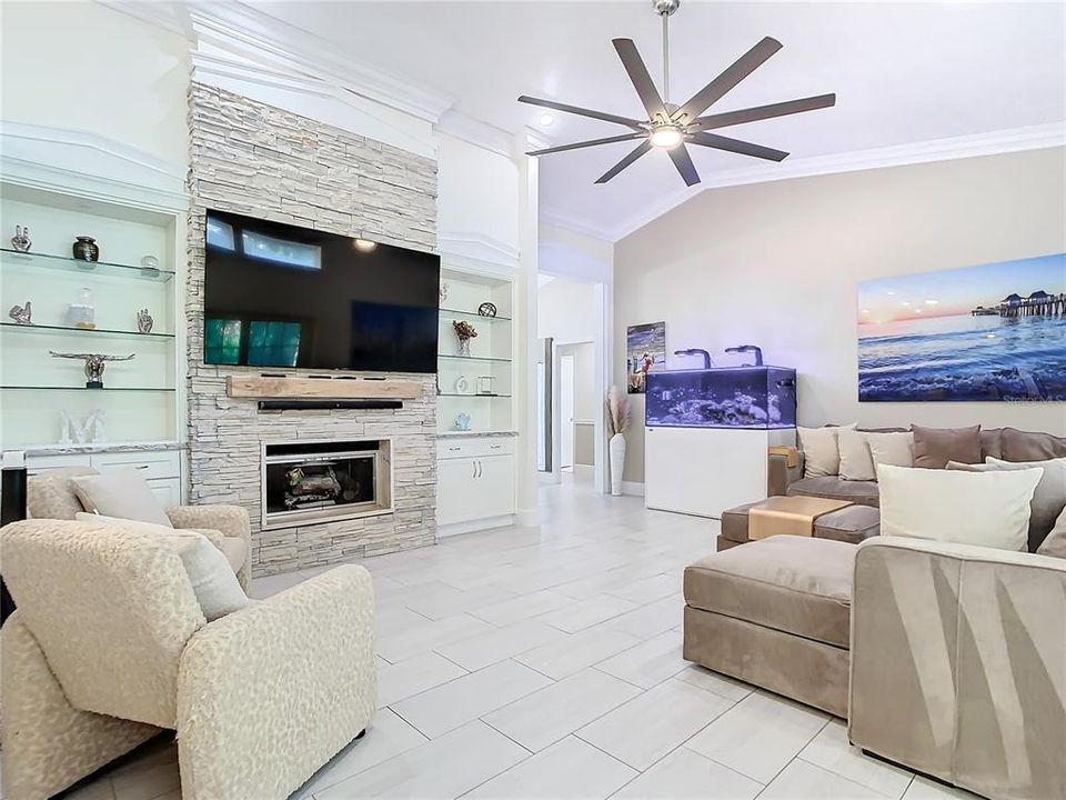 Wood Burning Fireplace with custom bookcases hugging the center