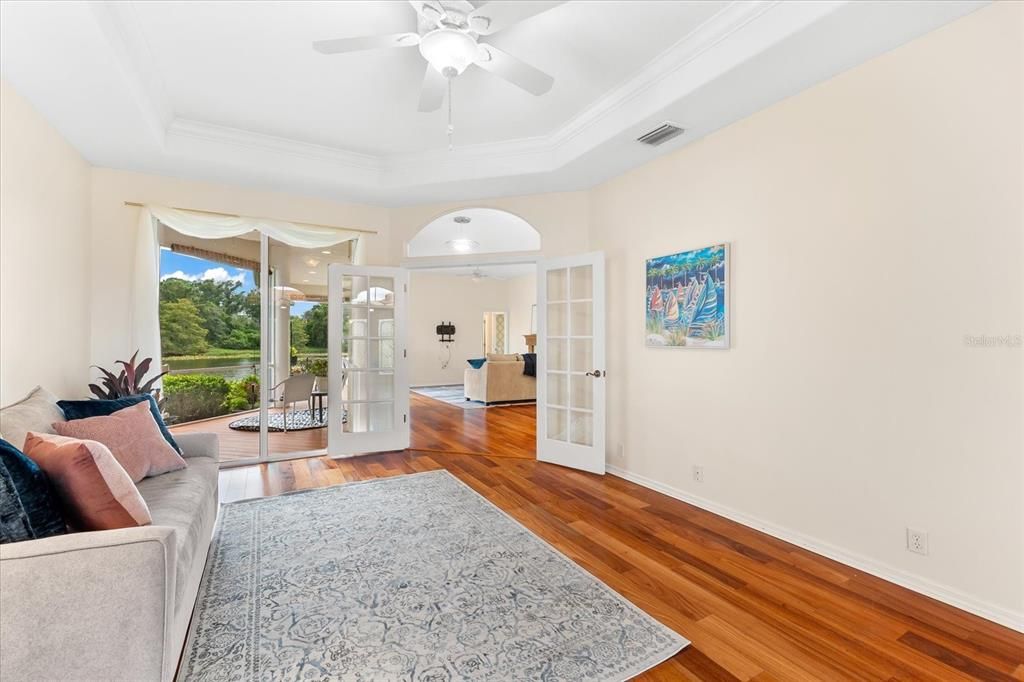 Living Room with sliders to the lanai and with lake view