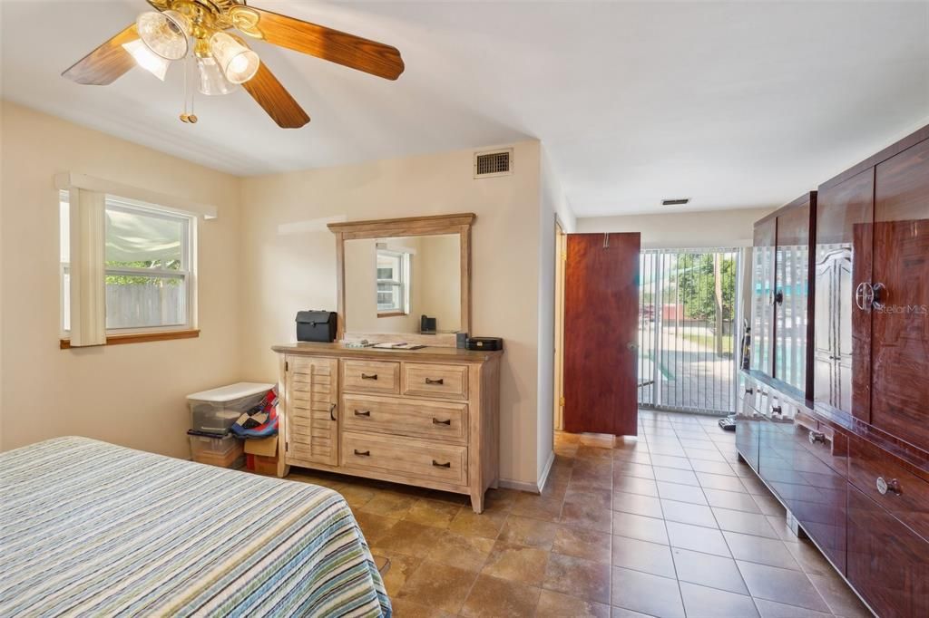 Primary Bedroom 1 with Doors to Pool