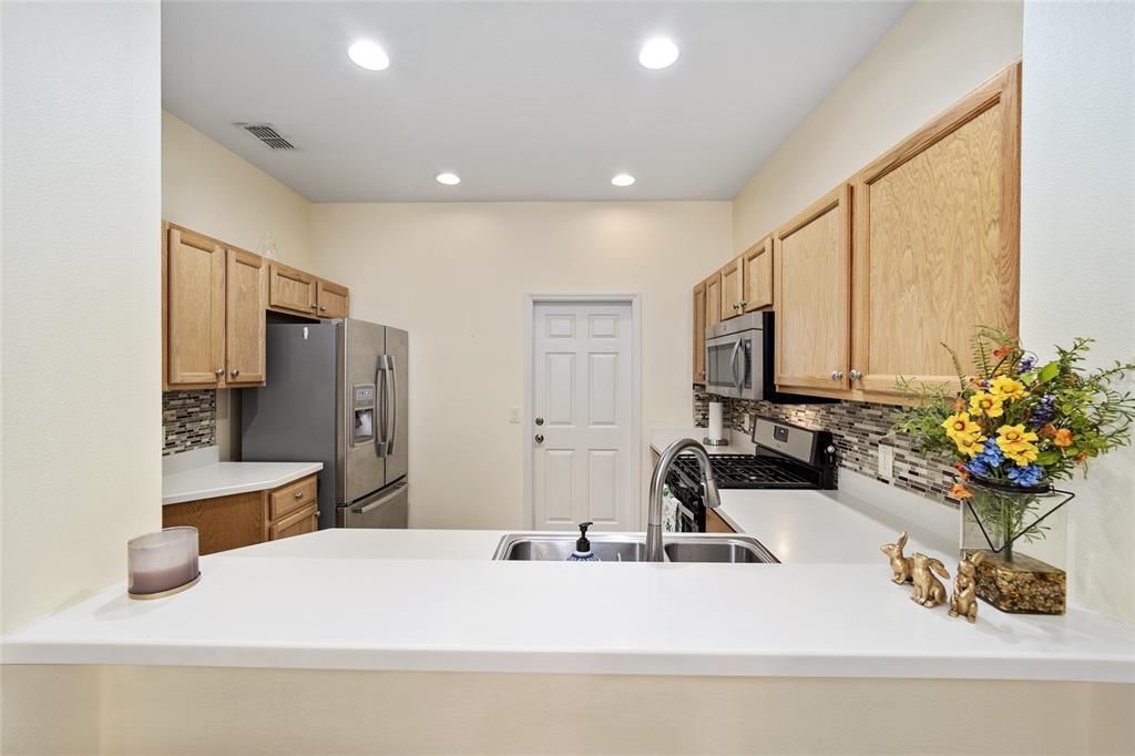 Breakfast Bar Opening to Dining Room