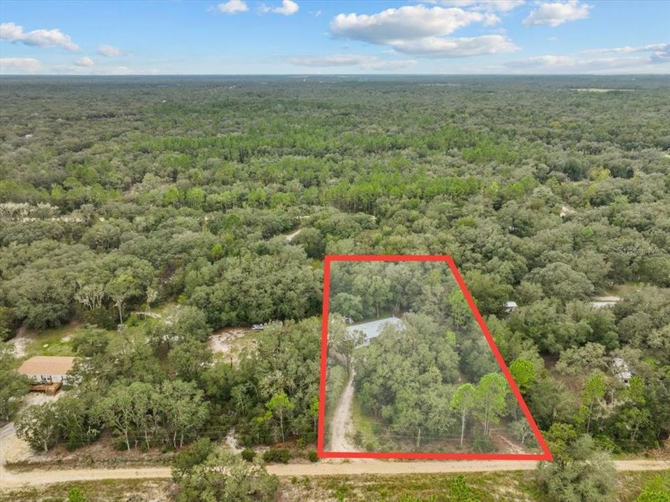 Drone shot of neighbor but gives context for this parcel which is to the left.