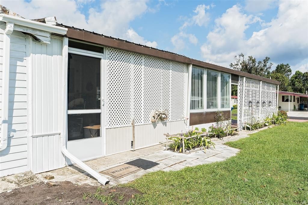 Carport and Side of the Back  screened porch /lanai , then glass windows of the Florida room and Carport area covered. All  very private.