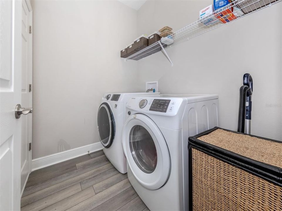 The laundry room offers plenty of space for a side by side