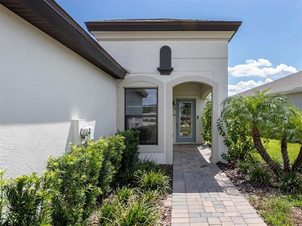 The front glass door and large foyer are very inviting to guests