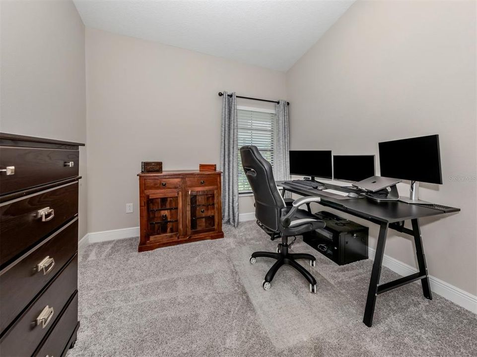 The second bedroom is being used as an office and includes a closet.