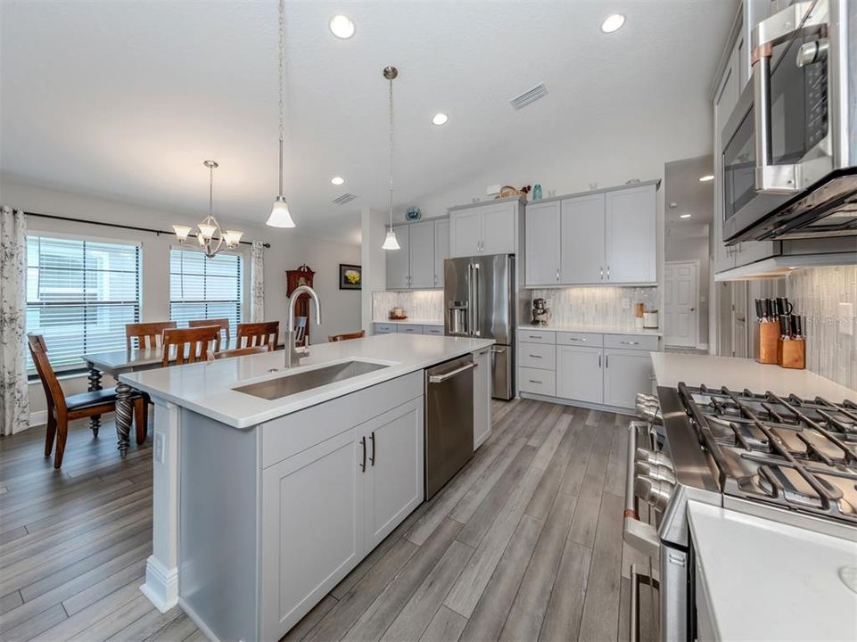 Quartz countertops throughout and solid wood cabinetry with soft close doors and drawers!