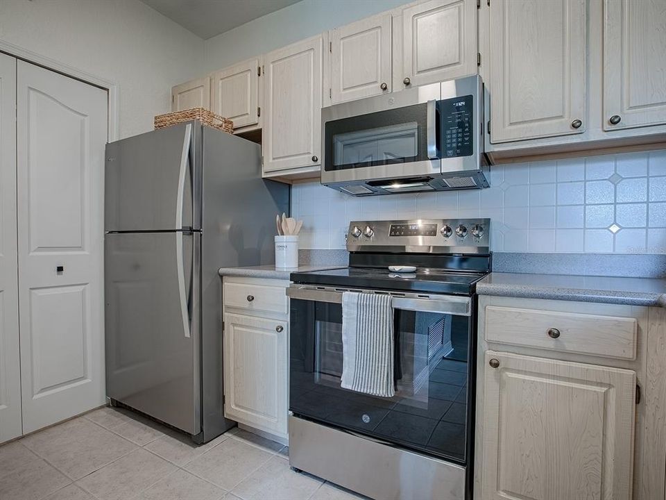 New Stainless Steel Appliances, including Garbage Disposal and Microwave mounted over the Range.