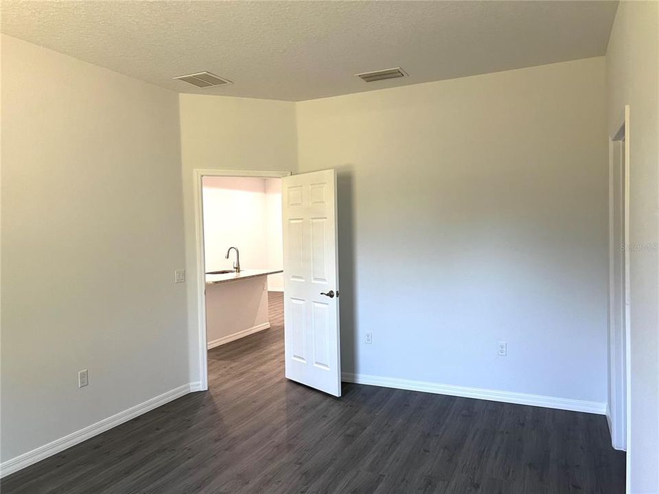 Master Bedroom access to kitchen/living area