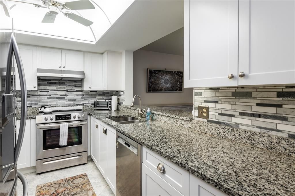 Stunning kitchen showing pass thru to Dining room