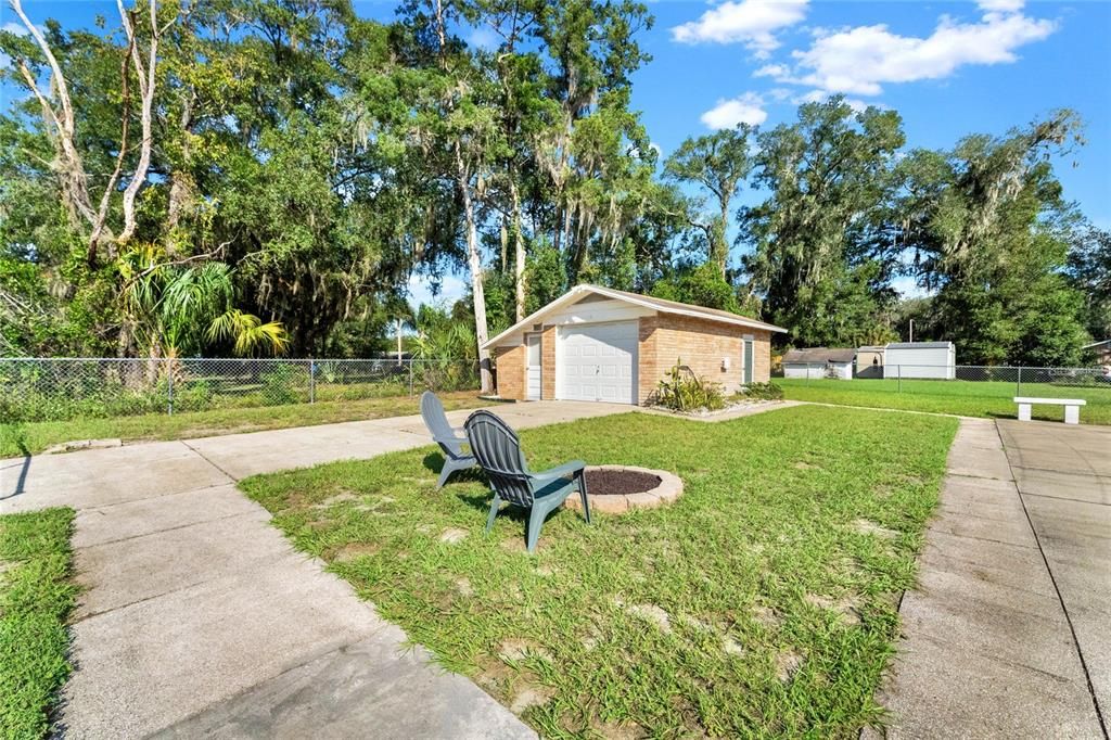 View of the yard, fire pit and Detached garage