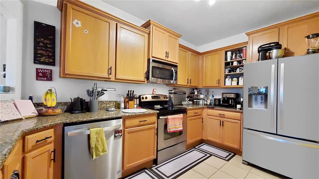 Kitchen with Stainless Steel appliances and solid stone countertops