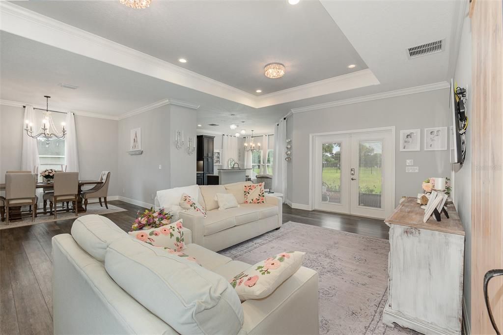 Family Room with French Doors that lead to the screened Lanai and views to the Golf Course