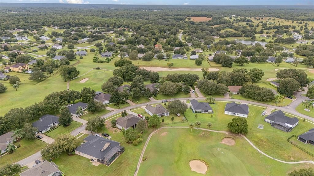 Aerial taken from high above the 1st Green.   Home is the one in the left-center with the fence