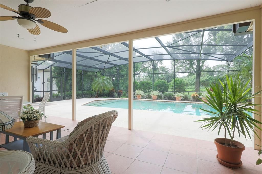 Spacious covered patio ready for sunrise pond views