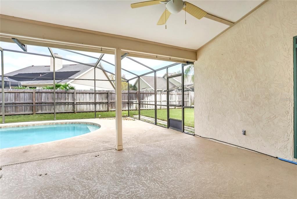 Covered lanai overlooking pool.