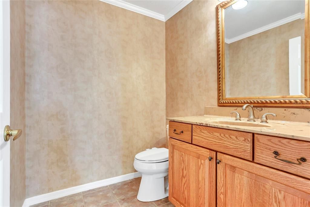 Half bath for guests off the family room.