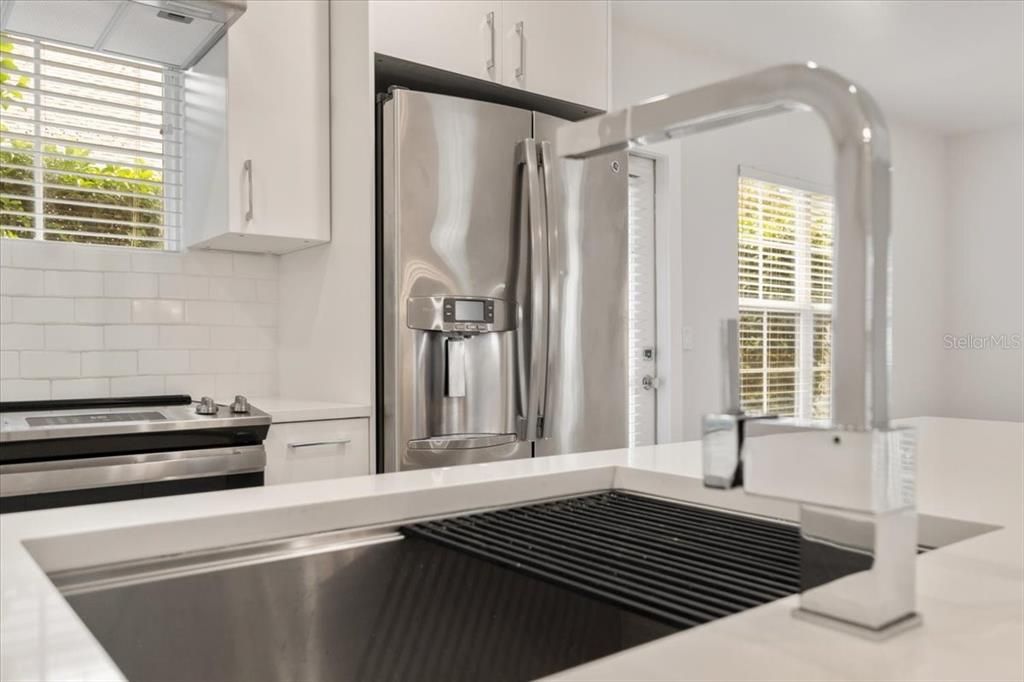 Kitchen with upgraded sink and faucet