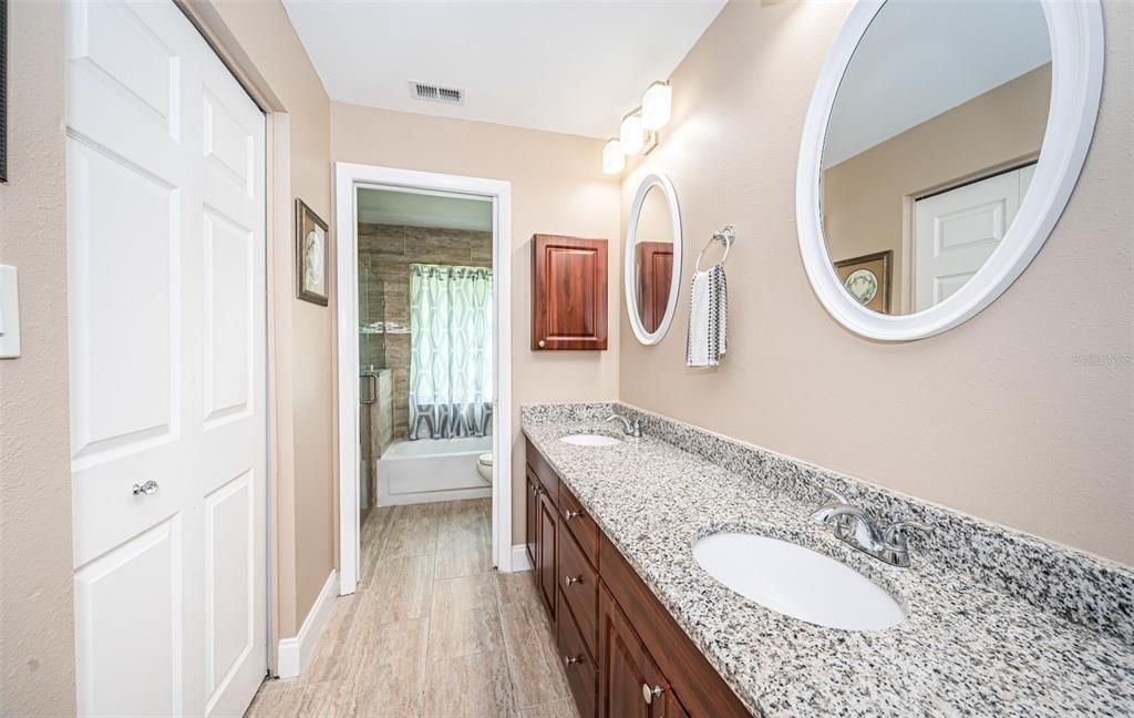 Double vanities and granite counter in primary bath