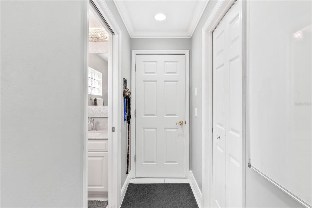 Hallway leading to Guest Half Bath and Laundry Room