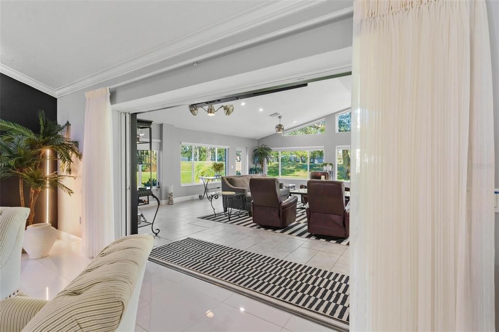 Living Room with Four Sliding Pocket Doors leading to Great Room