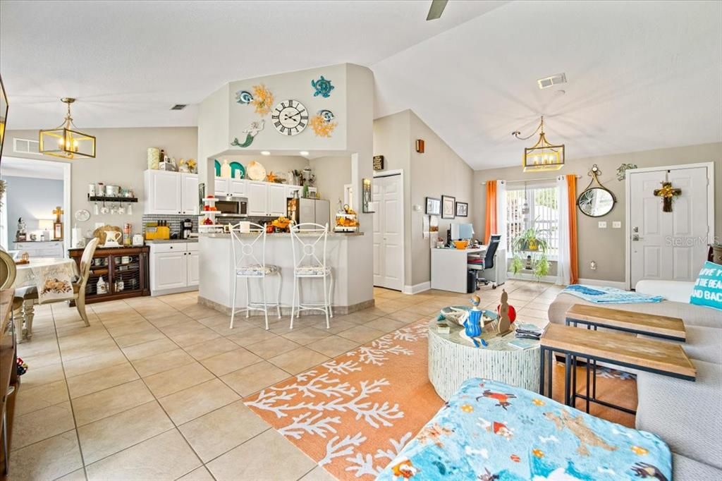 living area with kitchen dining area to the right