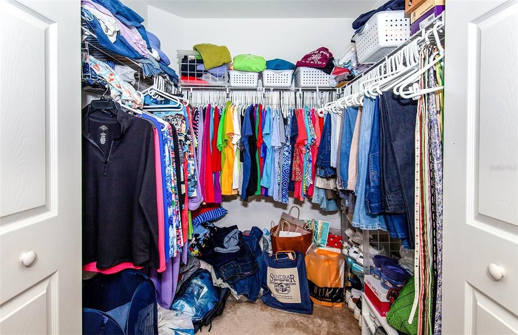 Primary bedroom walk in closet