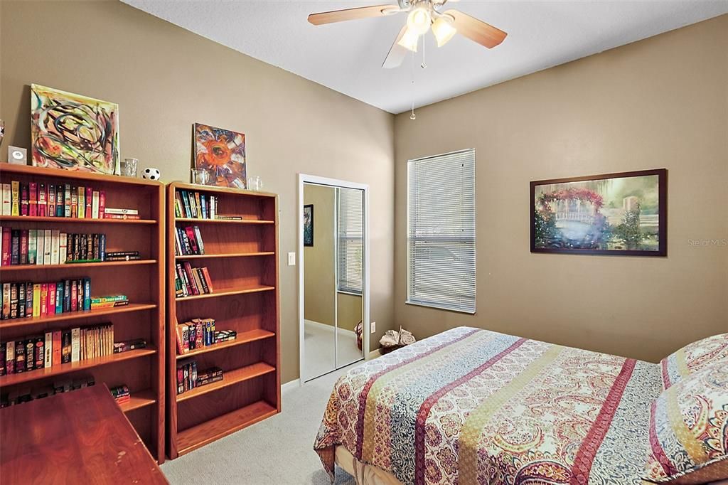 guest bedroom with walk in closet