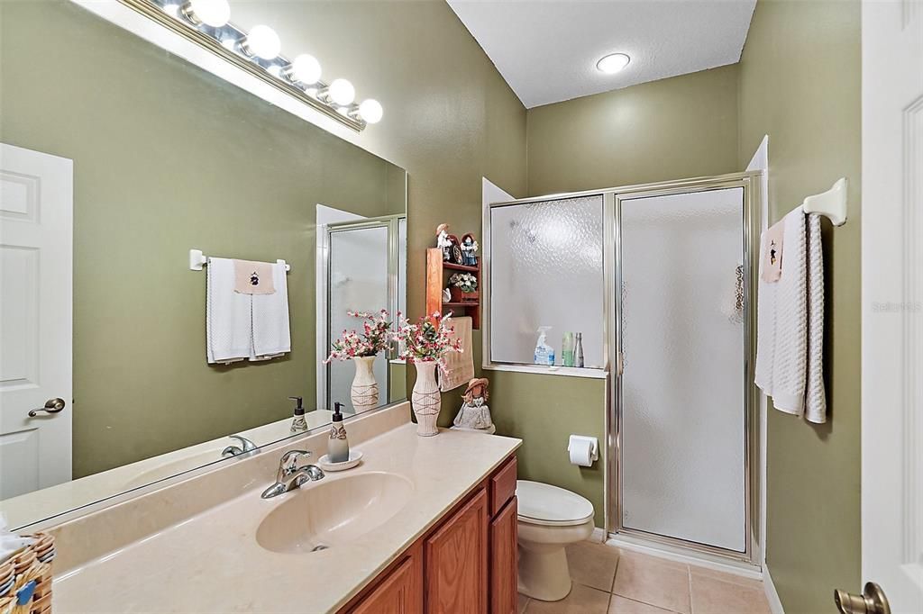 Hall bath with cultured marble sand color countertop