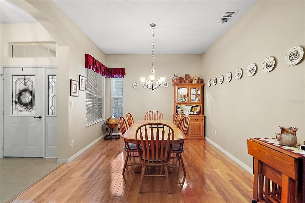 large formal dining room with hard wood flooring adds warmth for those special occasion dinners