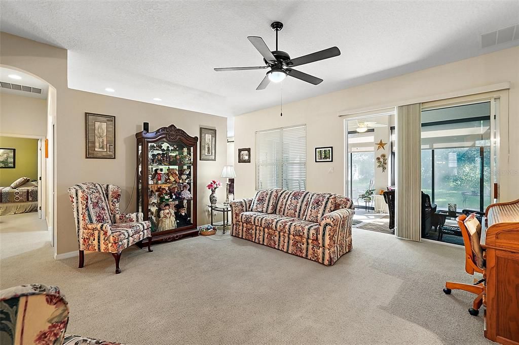 living room with double sliding doors to Lanai