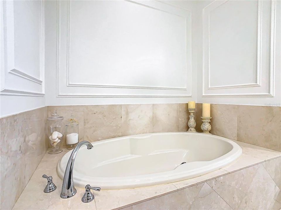 Luxurious Soaking Tub encased in Travertine