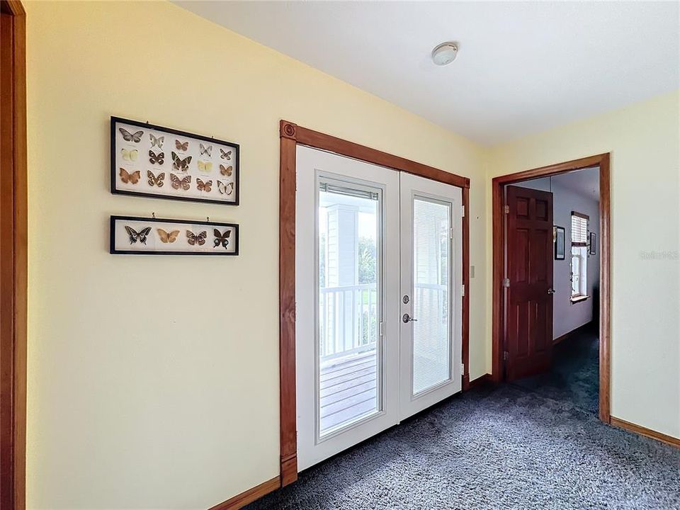 French doors on upstairs landing to front balcony.