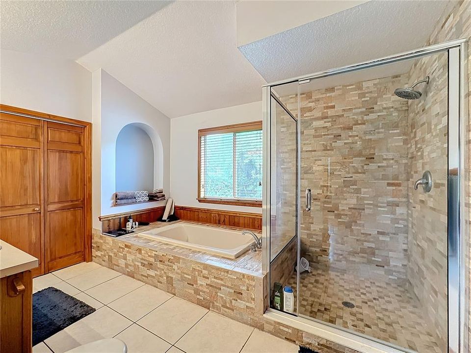 Primary bath, large walk in closet through the double doors.