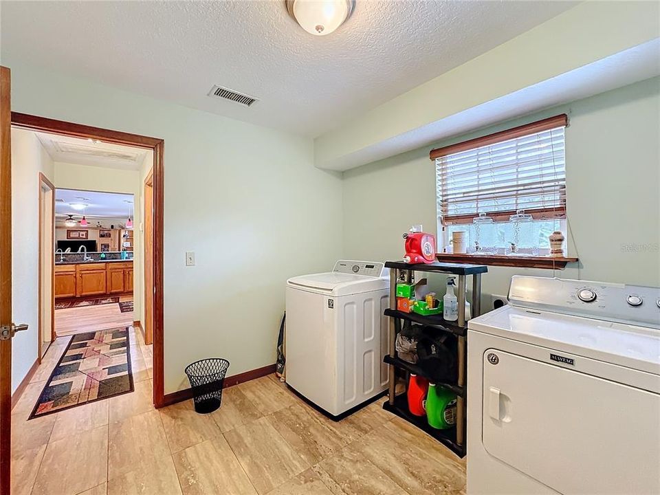 Laundry room just off kitchen and first floor bathroom.