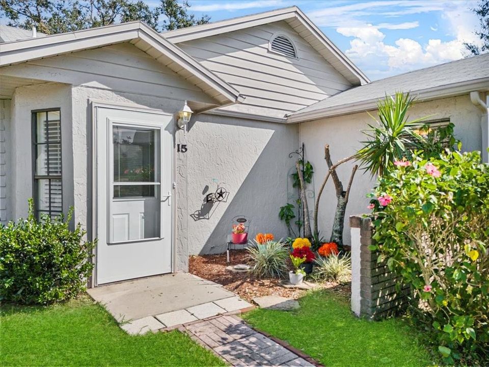 Front garden you can peek out on through the planation shutters in your eat-in kitchen