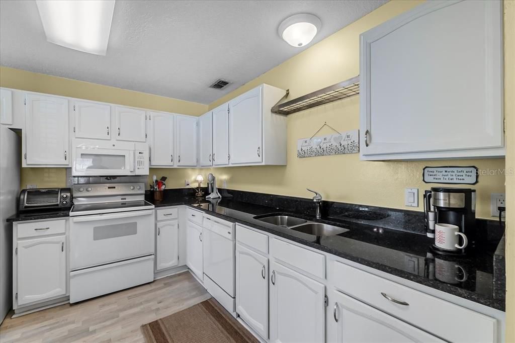 Kitchen with multiple chopping/work stations and brand new granite countertops!