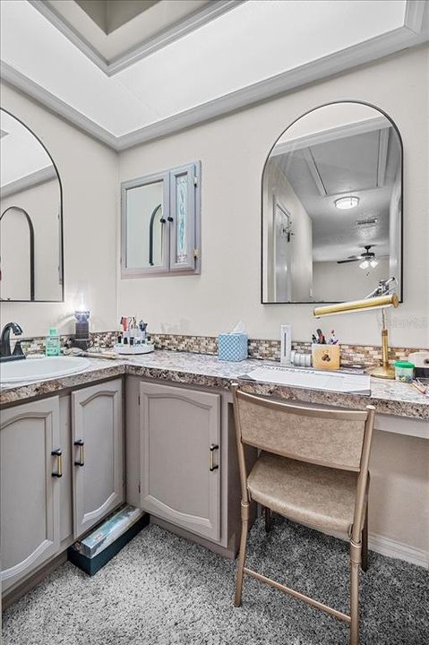 Owner's Oasis ensuite bath has a linen closet and a built-in desk or makeup station. How would you use it?