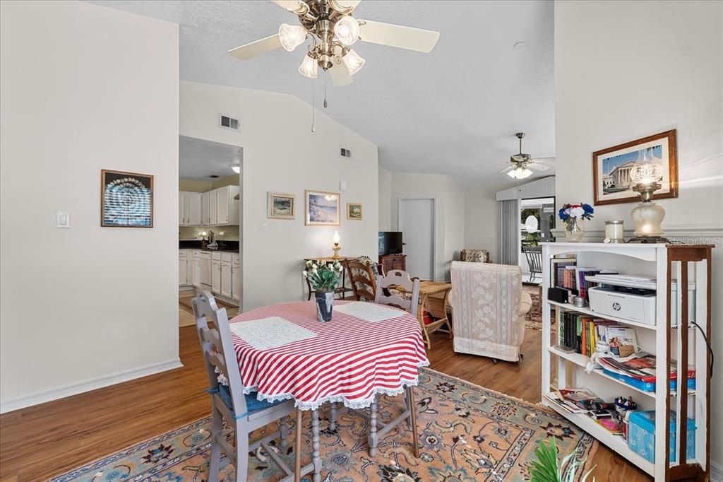 Dining Room flowing into the Living Room with a peek into the Kitchen