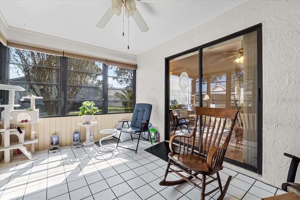 Ah, the Sun Room! With cool ceramic tile under your feet, windows surrounding you, air-conditioner set to your fave temp, and a view out onto the nice big yard you don't have to mow - what could be better? Bliss!